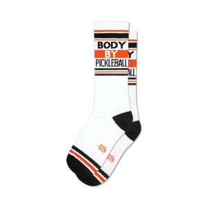 White crew socks with black and orange stripes and 'BODY BY PICKLEBALL' text.