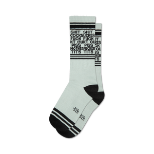 Pair of light teal crew socks with black stripes and repeated expletives printed vertically.