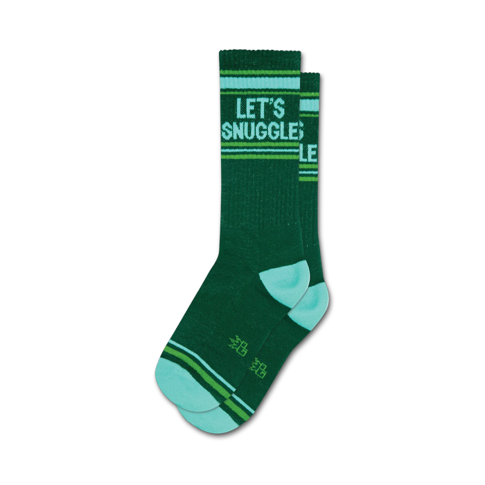 Pair of dark green crew socks with 'Let's Snuggle' in white text and teal and lime green stripes at the top and bottom. }}