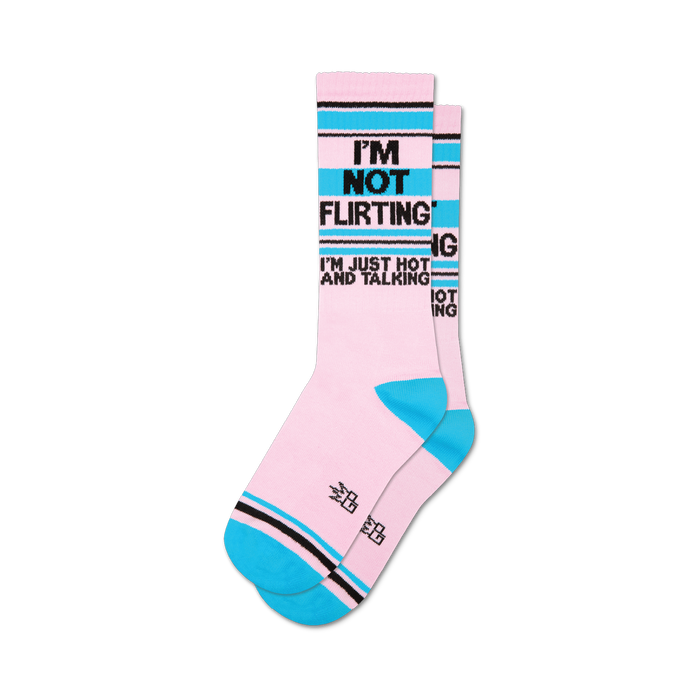 Pair of crew socks in pink, teal, and black.  The socks feature the text: 'I'm Not Flirting, I'm Just Hot and Talking'.