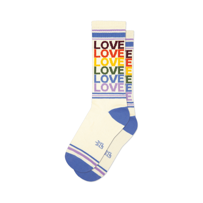 Cream crew socks with rainbow colored 'LOVE' text and purple, white stripes.