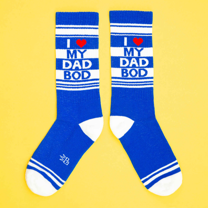 A pair of blue socks with white stripes and red heart. The socks have the words 