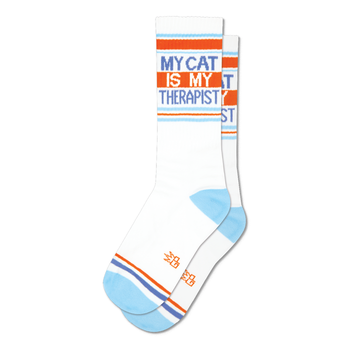 Pair of white crew socks with orange and light blue stripes and the text 'My Cat Is My Therapist'.