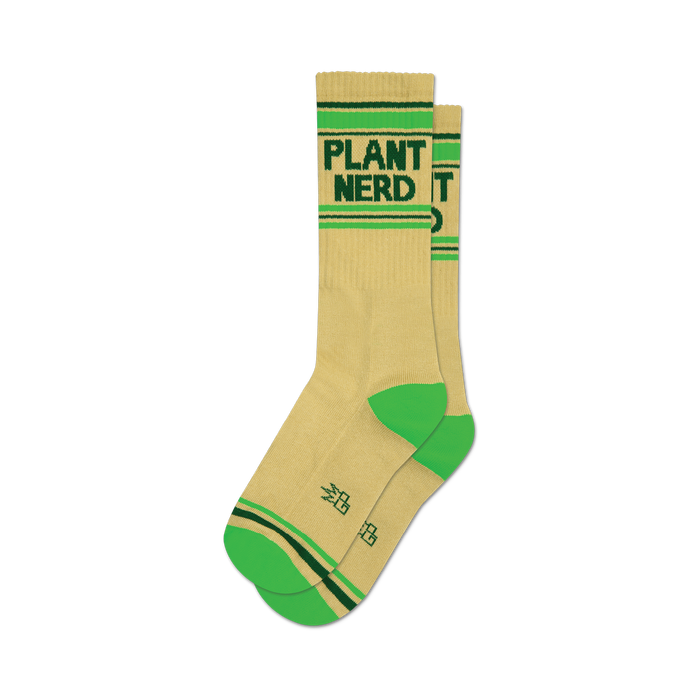 Pair of cream-colored crew socks with a 'Plant Nerd' graphic in dark green. Neon green stripes accent the top and bottom cuffs. }}
