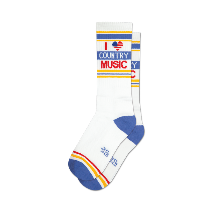 Pair of white crew socks with blue, yellow, and red stripes and an 'I heart country music' graphic. }}