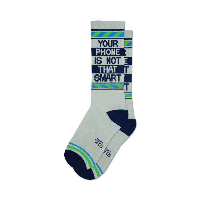 the white socks have the words 'your phone is not that smart' on them in blue. the words are surrounded by green and blue stripes. }}