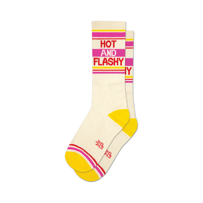 Pair of cream crew socks with yellow, pink, and red stripes. The text 'HOT AND FLASHY' is featured on the socks. }}