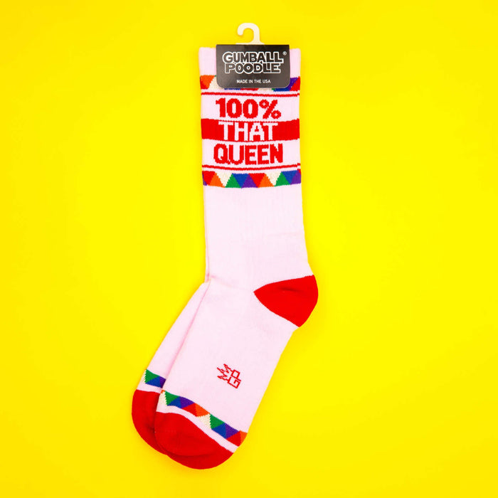 Single '100% That Queen' sock on a yellow background, shown on a hanger.