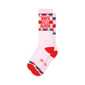 Pair of pink crew socks with red and rainbow stripes.  '100% That Queen' is written in red.