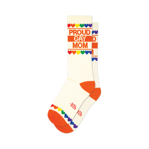 Cream crew socks with orange cuffs and toes.  'Proud Gay Mom' is printed in orange, accented by a rainbow heart border.