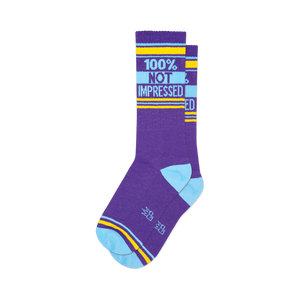 Pair of purple crew socks with light blue and yellow stripes and the text '100% NOT IMPRESSED'.