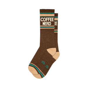 Pair of brown crew socks with a retro-style 'COFFEE NERD' graphic in cream and teal.  Features a peach-colored cuff.