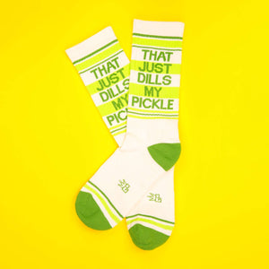 Flat lay of 'That Just Dills My Pickle' socks on a yellow background.