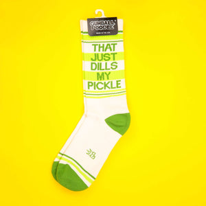 'That Just Dills My Pickle' socks on a yellow background; packaging visible.