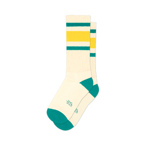 Pair of cream crew socks with green and gold stripes and teal cuffs.
