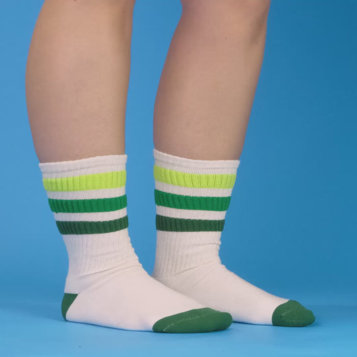 Folded Greg sock on brown background, showing folded texture and color