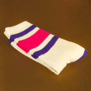 Folded sock: A single Jan sock folded neatly on a golden brown surface.