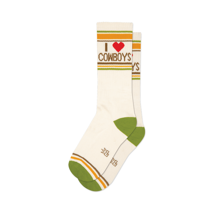 Pair of cream crew socks with green, yellow, and brown stripes and 'I love cowboys' graphic. Red heart detail.