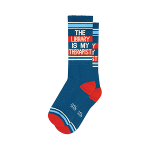 Pair of teal crew socks with orange and white stripes. Text reads: 'The Library Is My Therapist'.