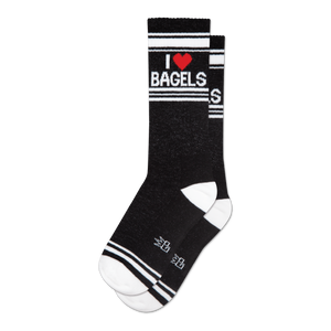 Pair of black crew socks with a white and red 'I Heart Bagels' design.  Features white stripes and a subtle sparkly texture.