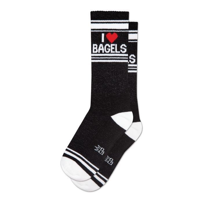 Pair of black crew socks with a white and red 'I Heart Bagels' design.  Features white stripes and a subtle sparkly texture.