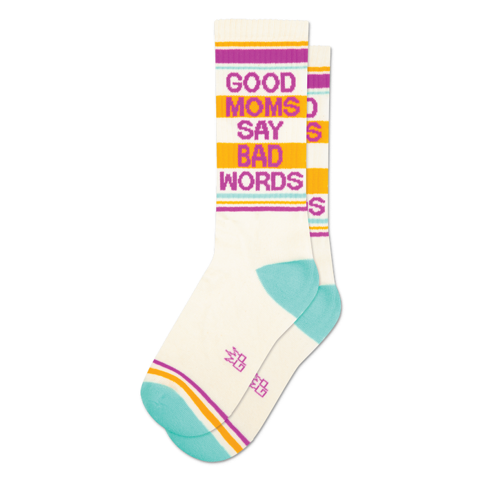 Pair of cream crew socks with teal, orange, and purple stripes and the phrase 'Good Moms Say Bad Words' in pink.