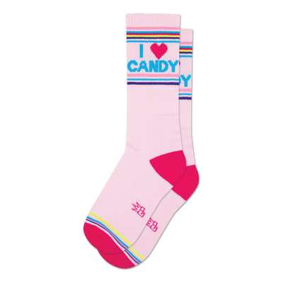 Pair of pink crew socks with a bright pink, blue, and purple stripe at the top and bottom. The socks feature the text 'I Heart Candy' in a playful font.