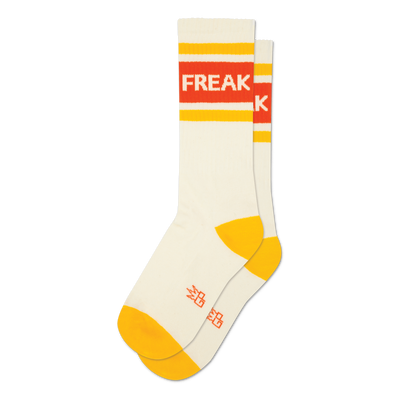 Pair of cream crew socks with orange and yellow stripes and the word 'FREAK' displayed.  A fun, retro design.