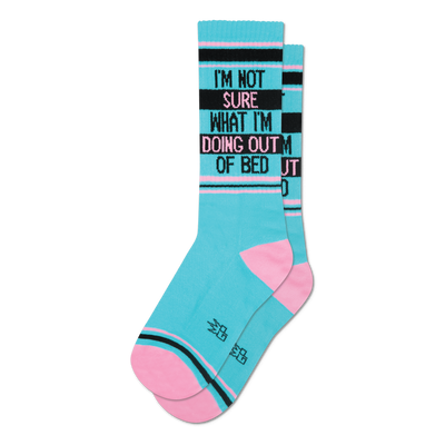 Pair of teal crew socks with pink and black stripes.  Text reads: 'I'm not sure what I'm doing out of bed'.