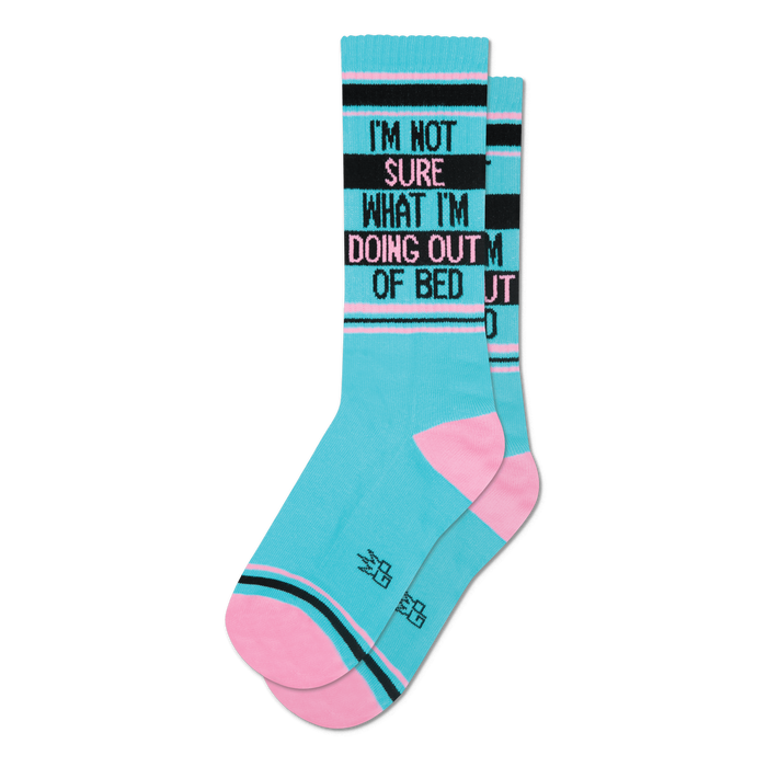 Pair of teal crew socks with pink and black stripes.  Text reads: 'I'm not sure what I'm doing out of bed'.