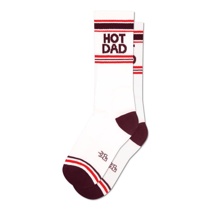 Pair of white crew socks with maroon and red stripes and 'HOT DAD' text.  Retro style.