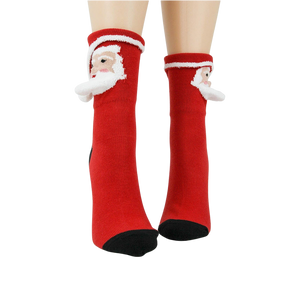 Close-up of Santa 3D socks on a model's feet, showing the design detail.