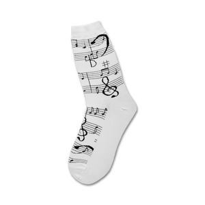 Close-up of white crew socks with black musical notes and clefs.