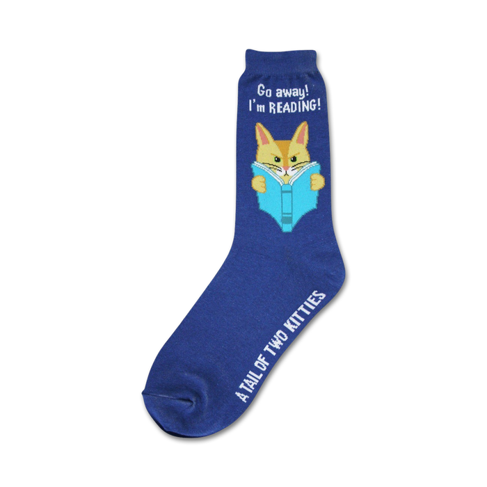 A navy blue crew sock features a cute orange cat reading a blue book. The text 'Go away! I'm reading!' is on the sock. The brand 'A Tail of Two Kitties' is on the bottom. }}