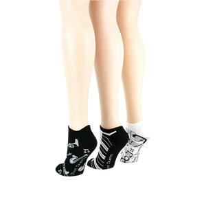 Lifestyle shot: different angle showing three pairs of musical socks on mannequin legs.