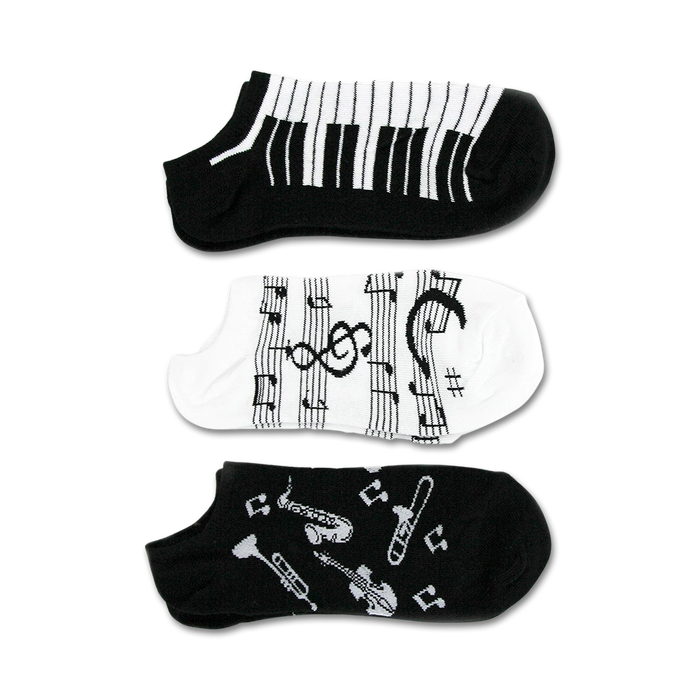 women's musical 3 pack no show socks feature piano keys, musical notes, and instruments.   