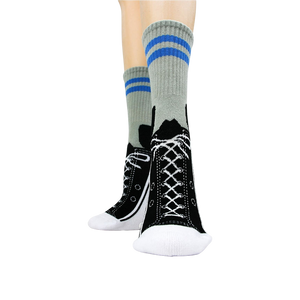 A pair of gray socks with black soles and blue stripes near the top. The socks are designed to look like sneakers, with black laces and white midsoles. The word 