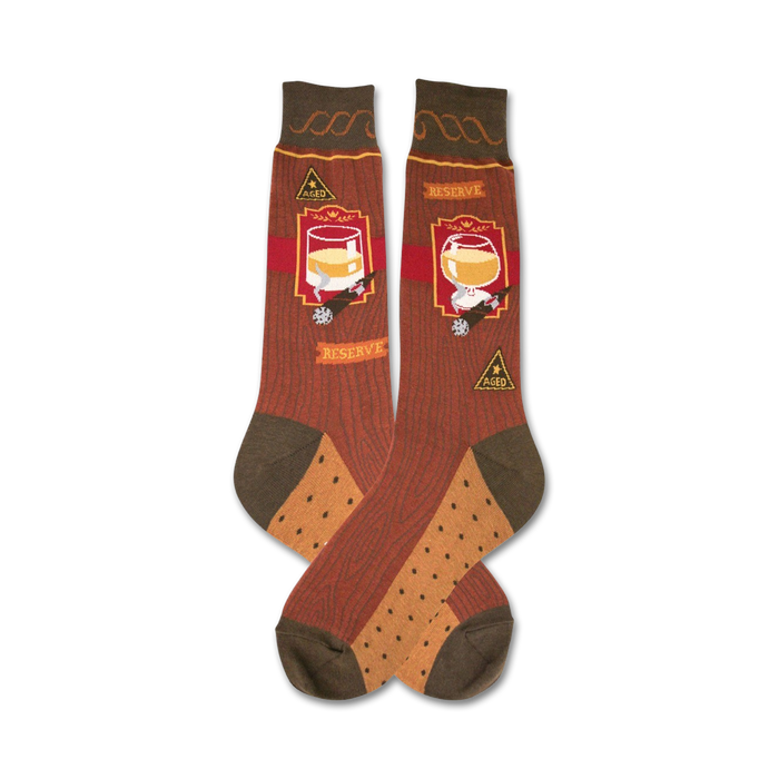 A pair of crew socks in brown and tan with a woodgrain pattern, a glass of bourbon, a cigar, and 'Aged' and 'Reserve' labels. }}