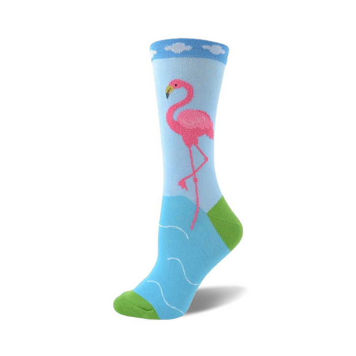 Crew socks in light blue featuring a pink flamingo standing in wavy blue water. The sock's cuff is light blue with white cloud details and a lime green heel and toe. }}