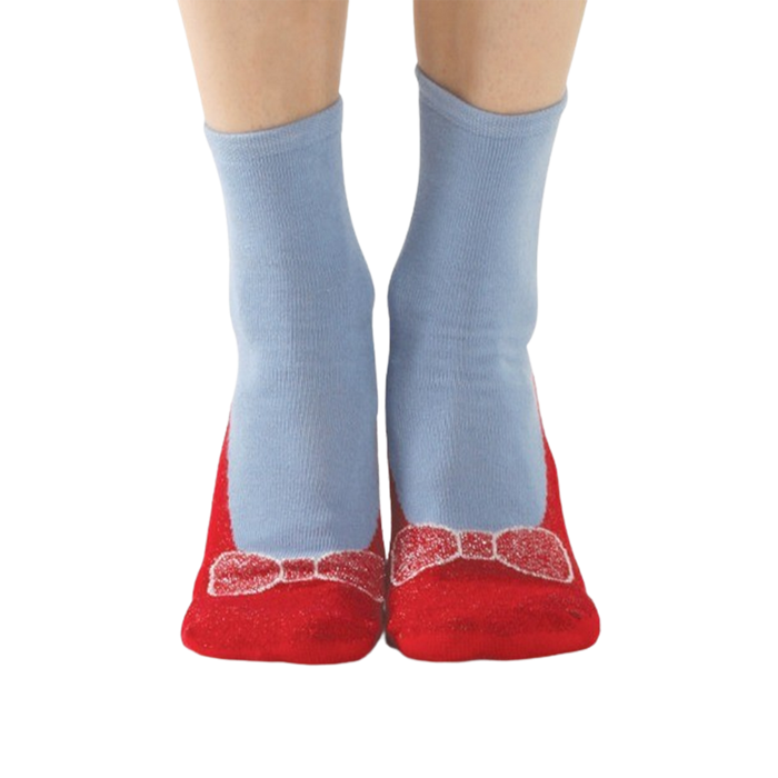 A pair of blue socks with red soles and a red bow on the toes. The soles have white polka dots and the words 