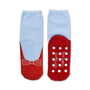 A pair of blue socks with red soles and a red bow on the toes. The soles have white polka dots and the words 