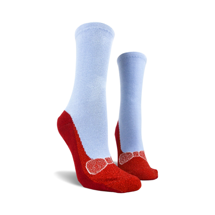 Pair of red and light blue non-skid slipper socks.  The bottom features red slipper design with a bow and non-skid grips.