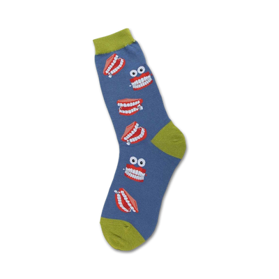Crew socks in blue with a playful design of red cartoon dentures and googly eyes. A lime green cuff adds a pop of color.