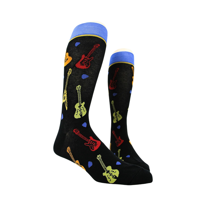 Pair of black crew socks with guitar designs shown on a mannequin.