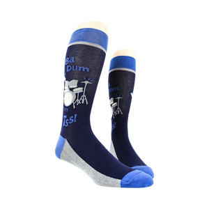 Lifestyle shot of two 'Drum Set' socks on a mannequin, showing the full design.