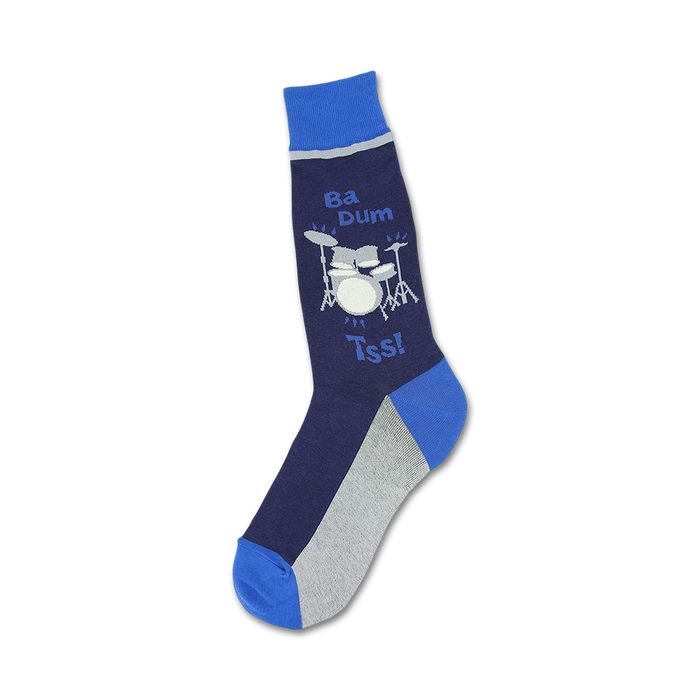 A pair of navy blue and gray crew socks with a fun illustration of a drum set and the words 'Ba Dum Tss!'