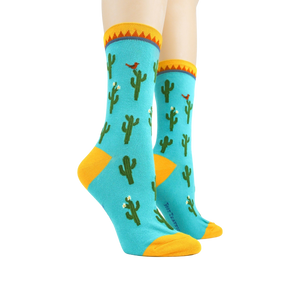 Pair of Cactus socks on mannequin legs showing the full design.