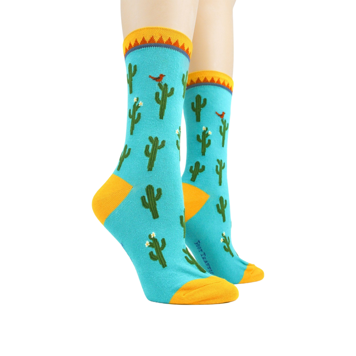 Pair of Cactus socks on mannequin legs showing the full design.