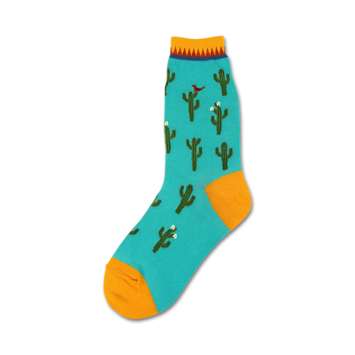 Teal crew socks with a repeating pattern of green cacti, small white flowers, and a red cardinal. Yellow cuff and top.