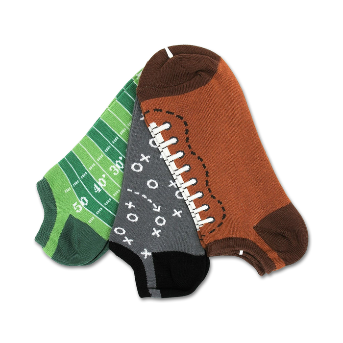 Three ankle socks: one green with a football field design, one gray with Xs and Os, and one brown with a football design. }}